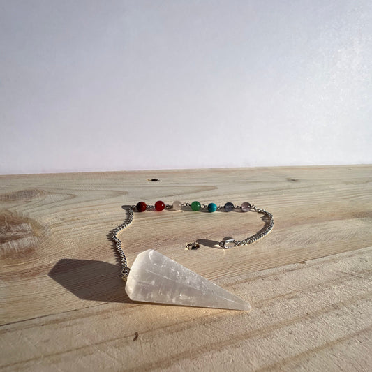 Selenite pendulum with silver chain and chakra beads.