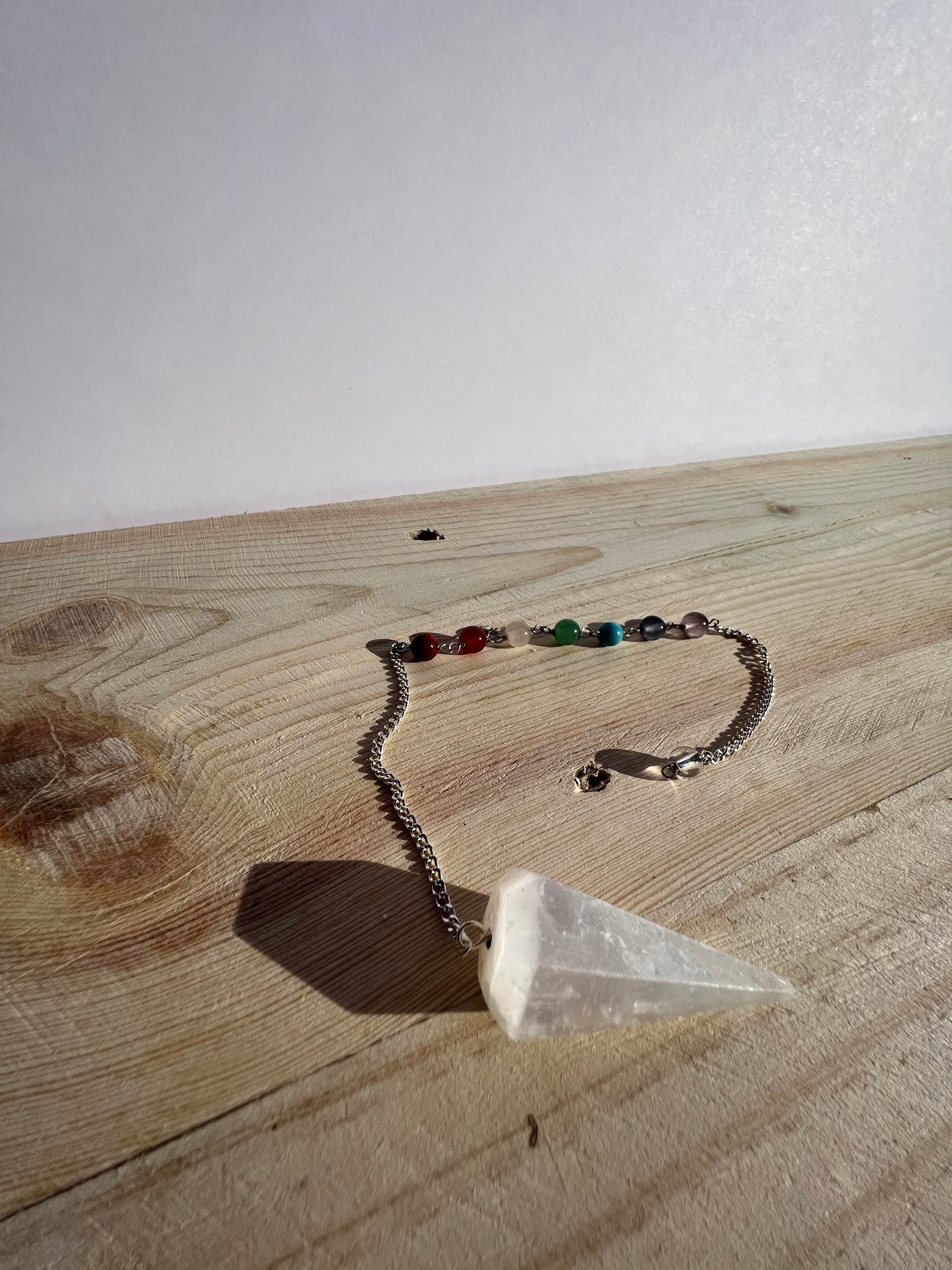 Selenite pendulum with chakra beads