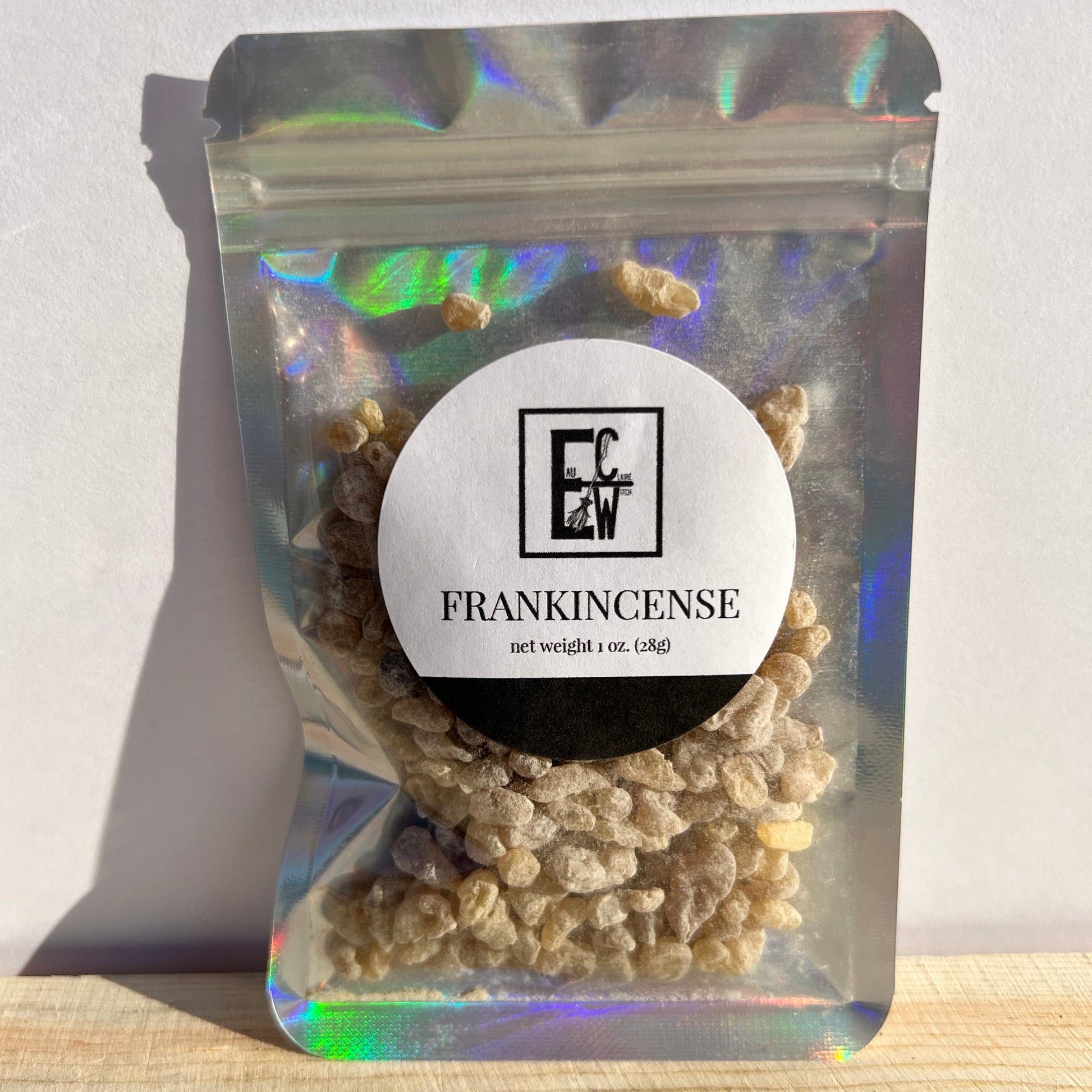 1 ounce of frankincense tears, in a holographic, zip-top bag. It features a label of contents & weight front & center.