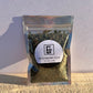 1/5 oz. blackberry leaves in a holographic, zip-top bag. It features a label of contents and weight as well.