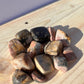 Tumbled Rhodonite stones